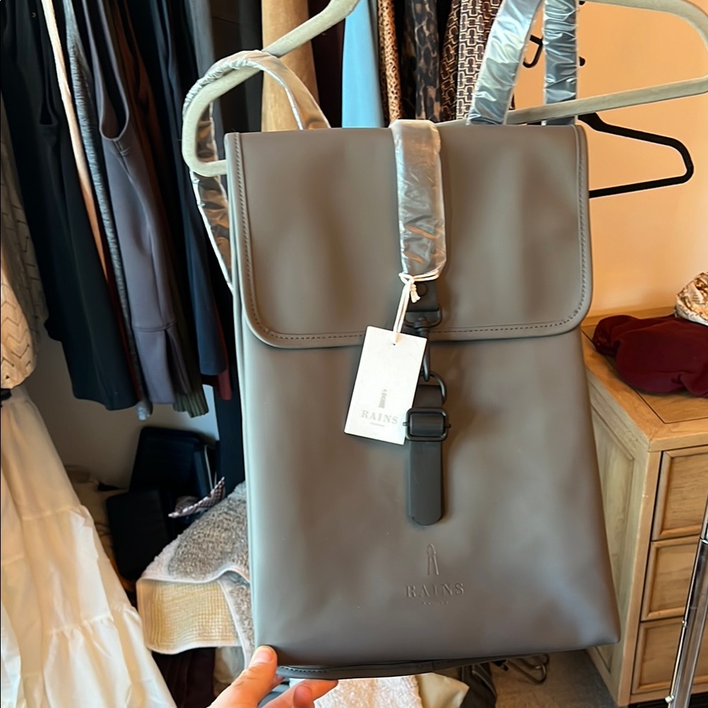 Rains Gray and Black Backpacks Minimalist Design